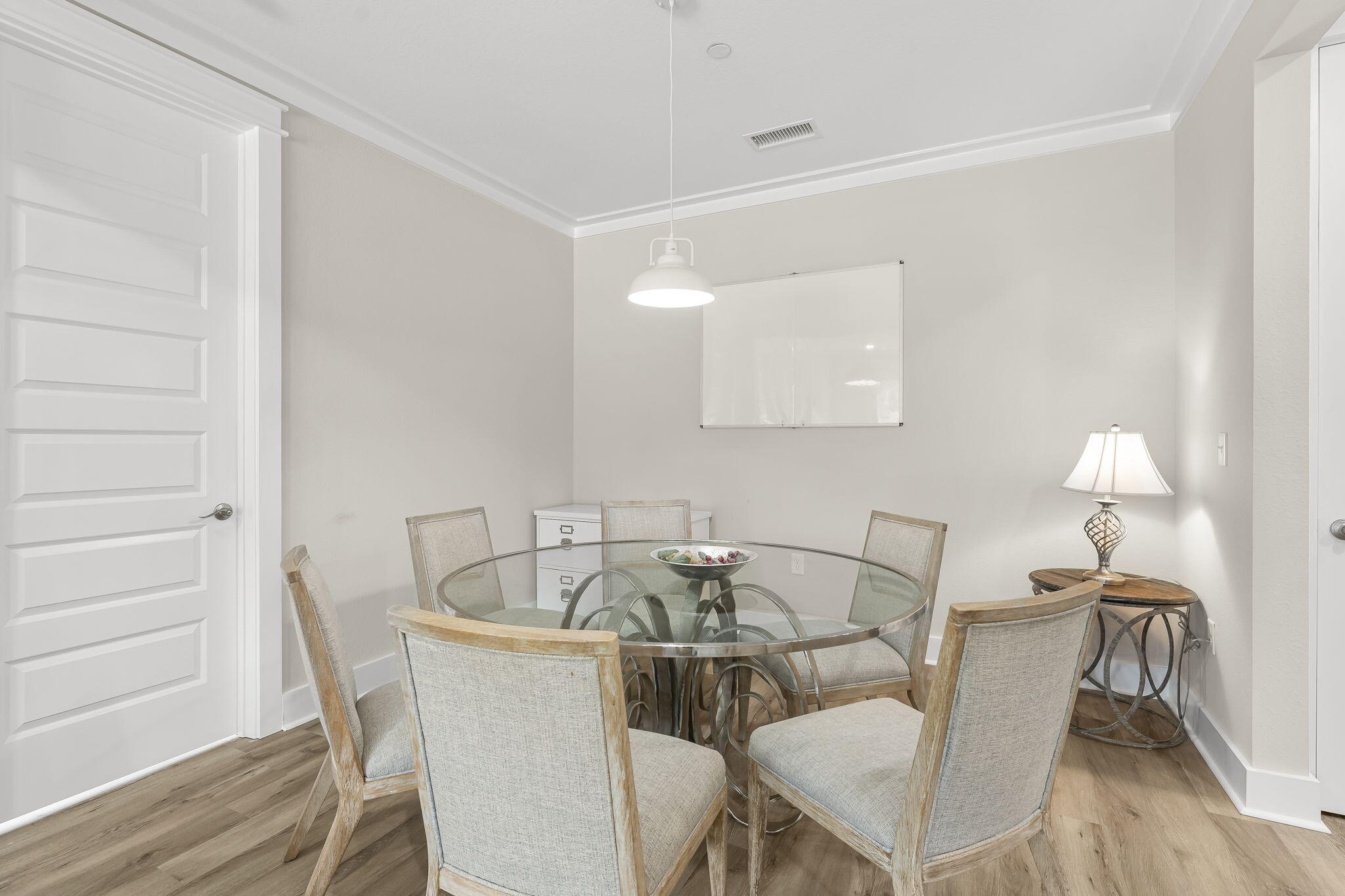 725 J D Miller Road, Unit 106 Santa Rosa Beach, FL 32459 - Photo 12 of 19 a view of a dining room with furniture and wooden floor