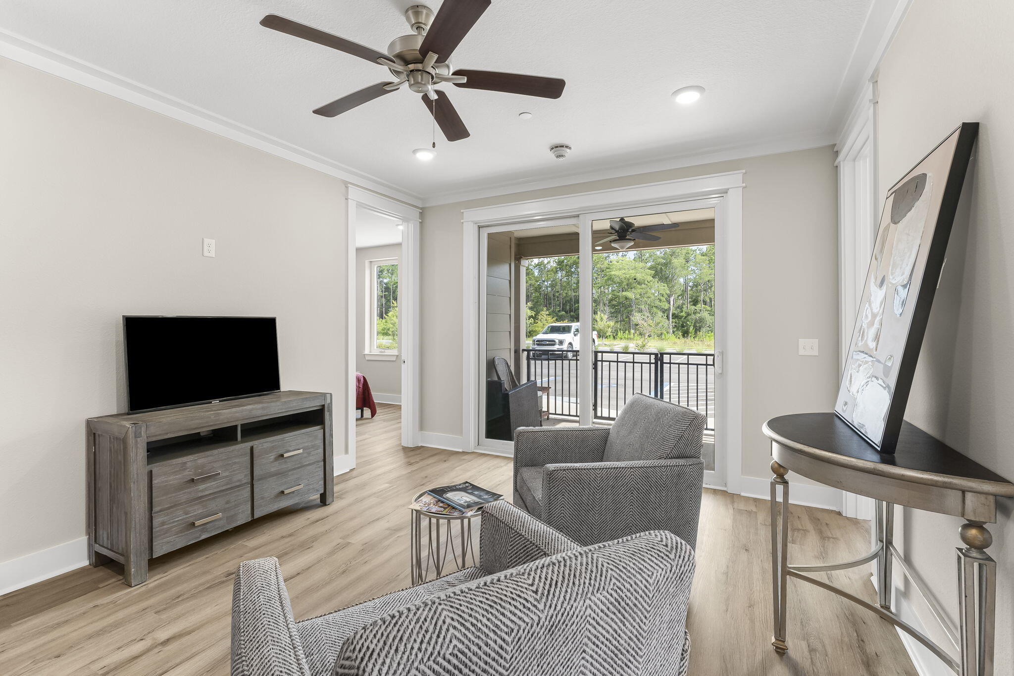 725 J D Miller Road, Unit 106 Santa Rosa Beach, FL 32459 - Photo 10 of 19 a living room with furniture and a flat screen tv