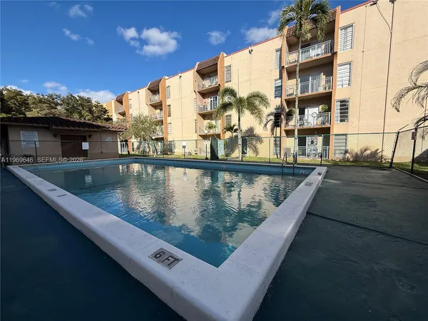 a view of swimming pool with a outdoor seating