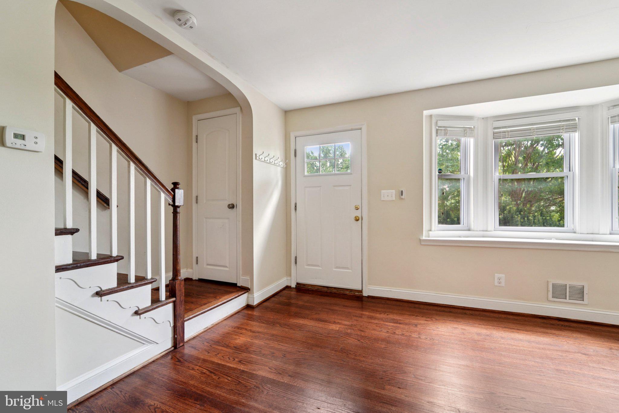 190 Dumbarton Road Baltimore, MD 21212 - Photo 3 of 24 a view of an entryway with wooden floor and door