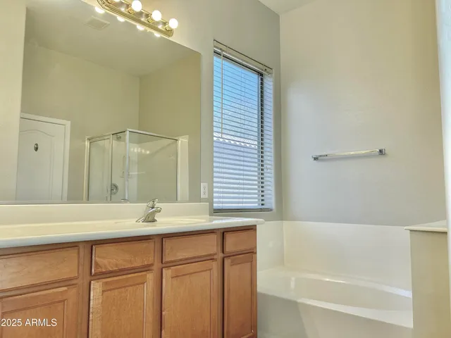 a bathroom with a bathtub and a sink