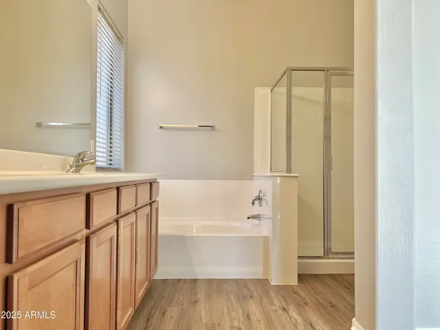 a bathroom with a bathtub and a sink