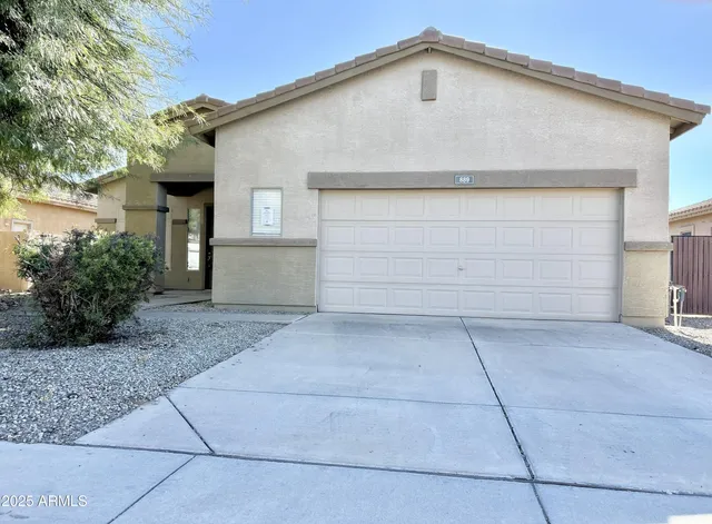 a front view of a house with garage