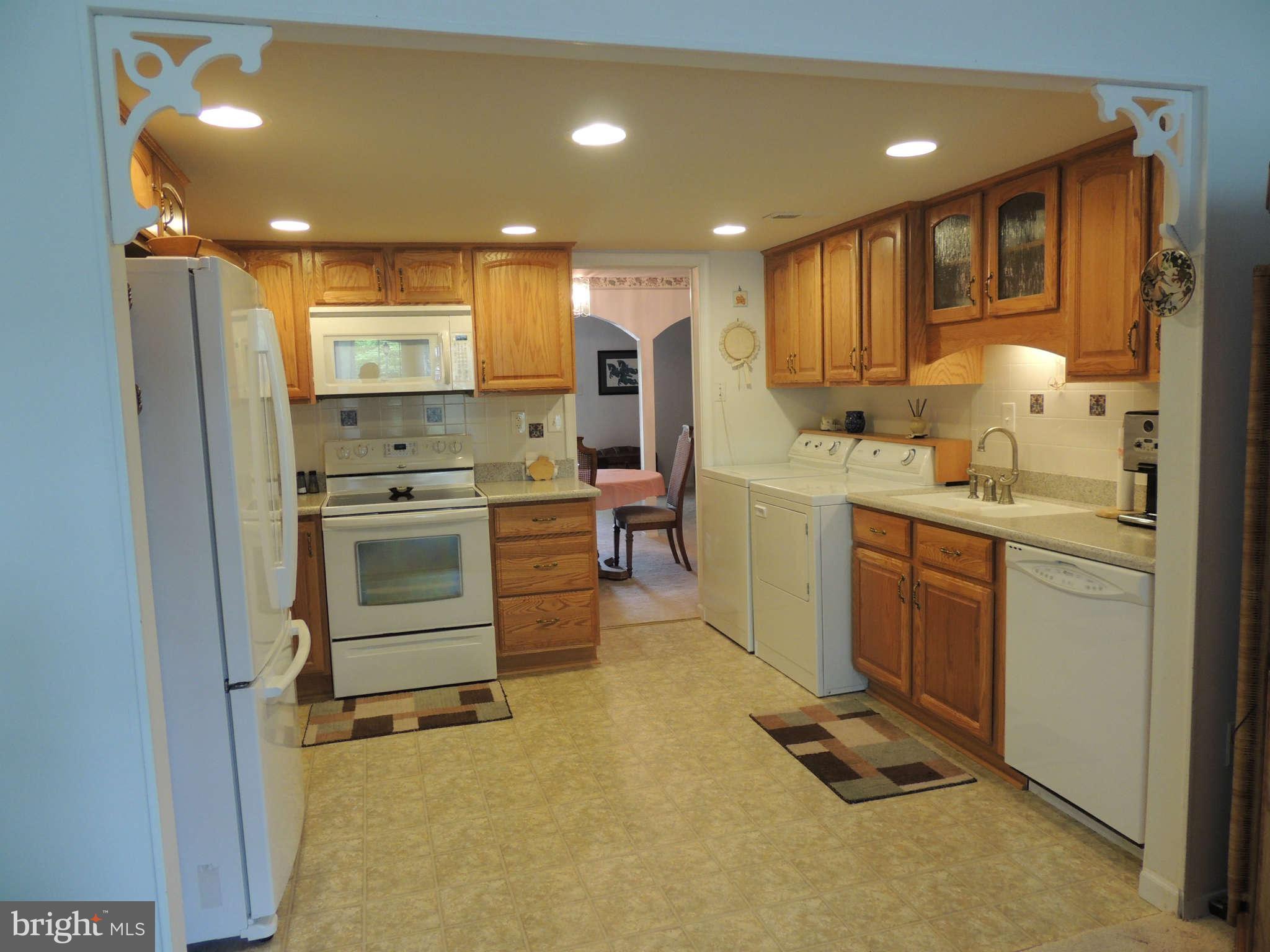 3795 Port Hope Point Triangle, VA 22172 - Photo 11 of 26 a kitchen with a sink appliances and cabinets