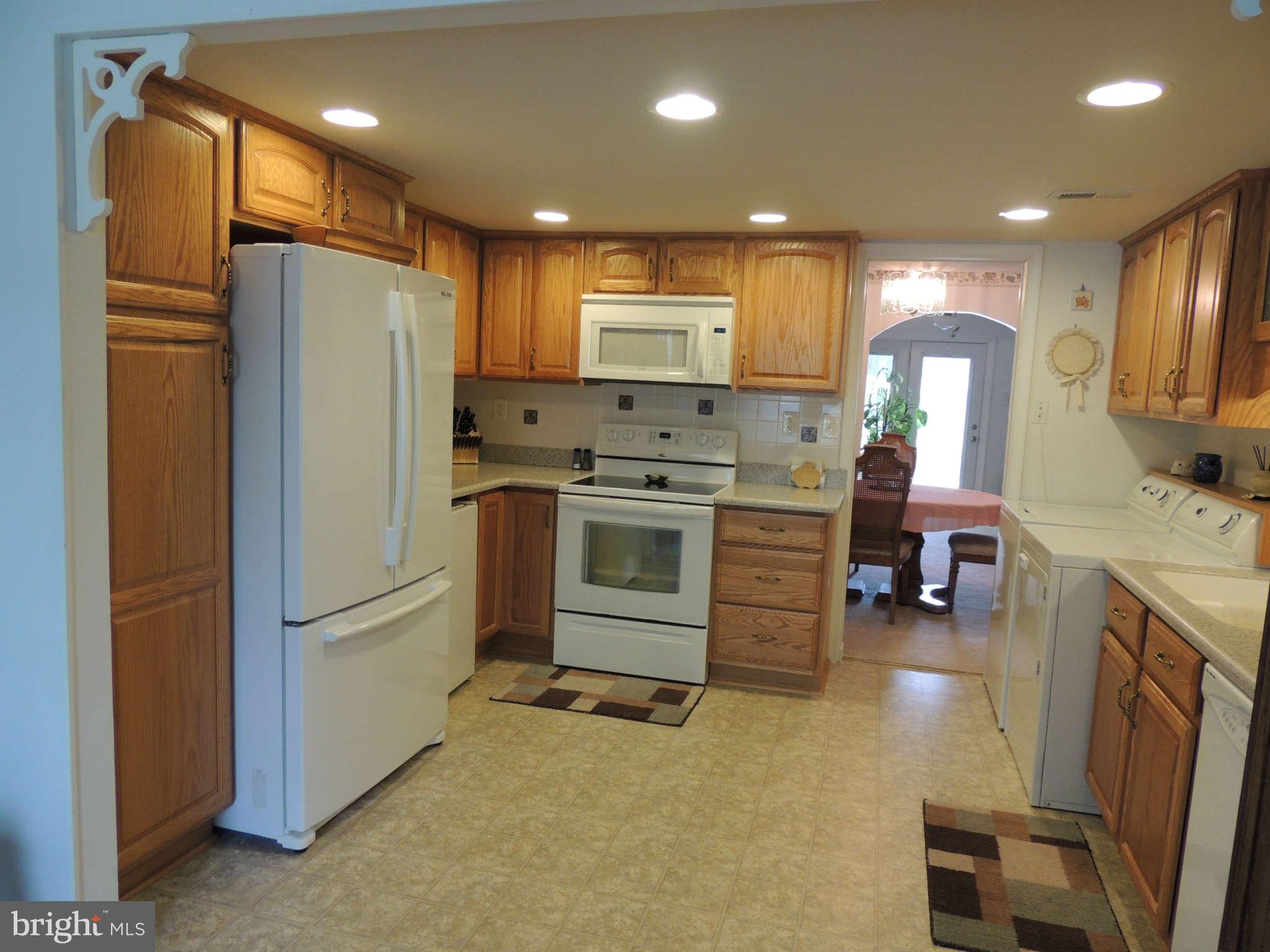 3795 Port Hope Point Triangle, VA 22172 - Photo 12 of 26 a kitchen with stainless steel appliances granite countertop a refrigerator stove and sink