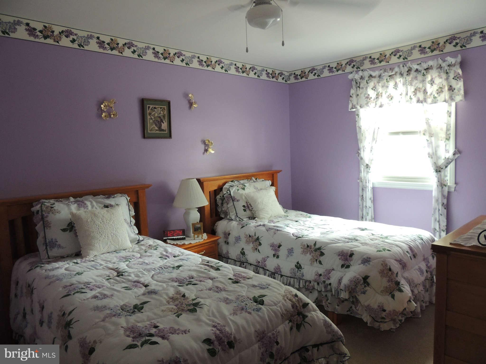 3795 Port Hope Point Triangle, VA 22172 - Photo 17 of 26 a bedroom with two beds and a window