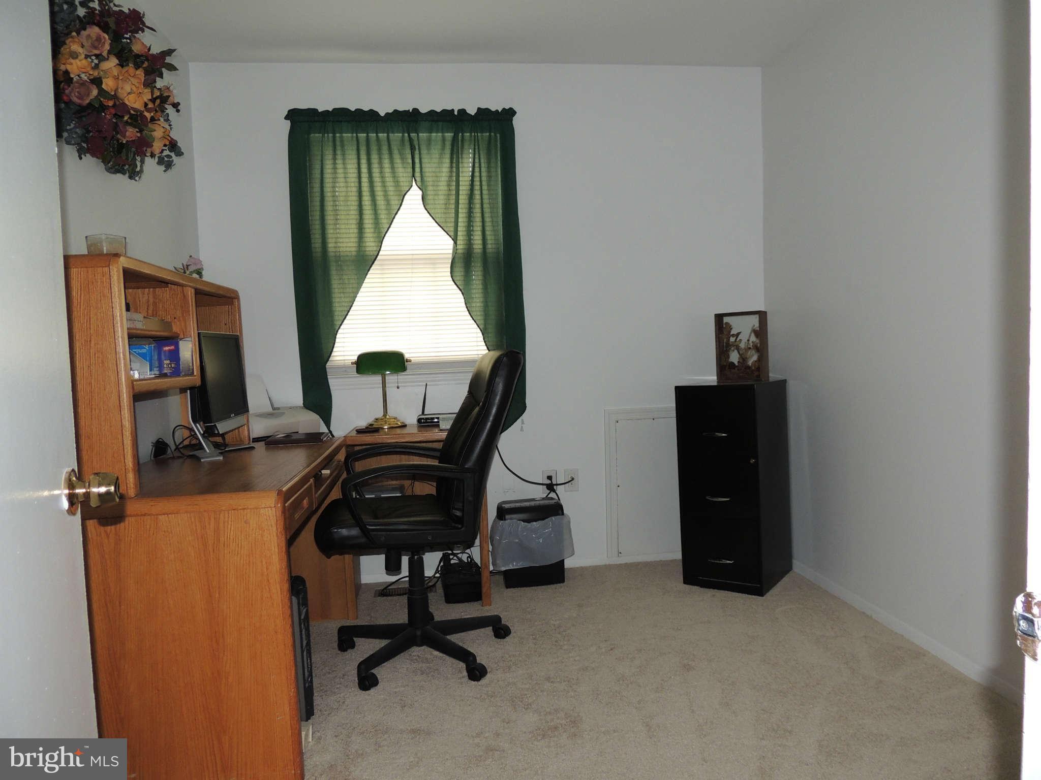 3795 Port Hope Point Triangle, VA 22172 - Photo 19 of 26 a view of a workspace with furniture and a window