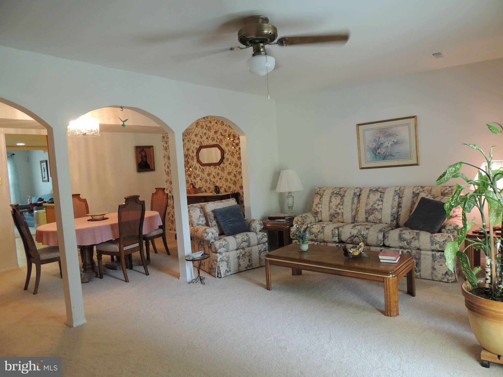 3795 Port Hope Point Triangle, VA 22172 - Photo 3 of 26 a living room with furniture and a clock