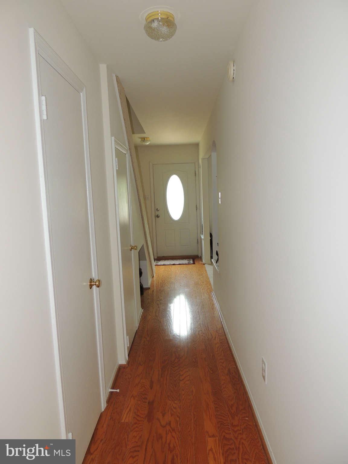 3795 Port Hope Point Triangle, VA 22172 - Photo 21 of 26 a view of a hallway with wooden floor