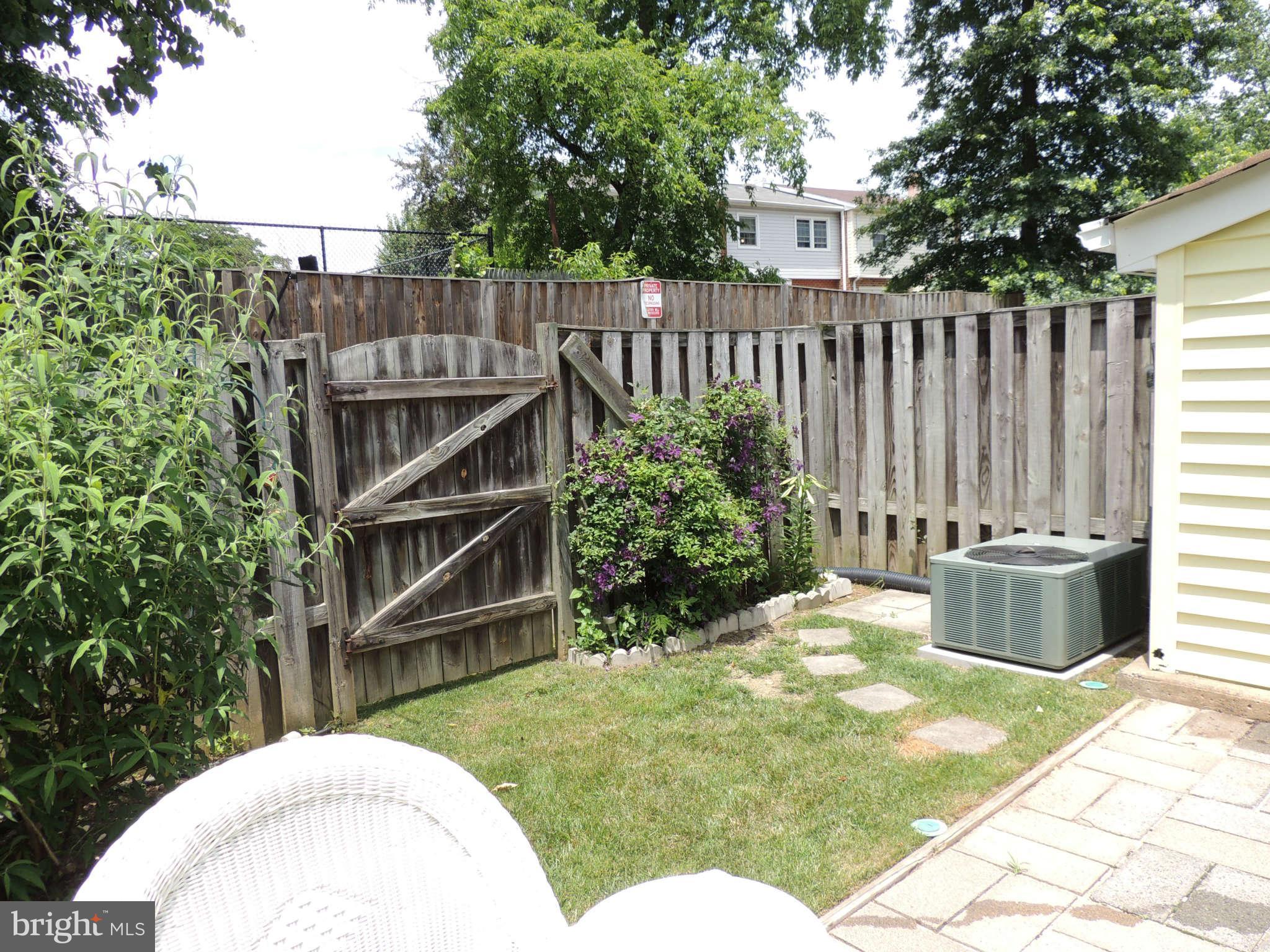 3795 Port Hope Point Triangle, VA 22172 - Photo 22 of 26 a view of a backyard with a garden