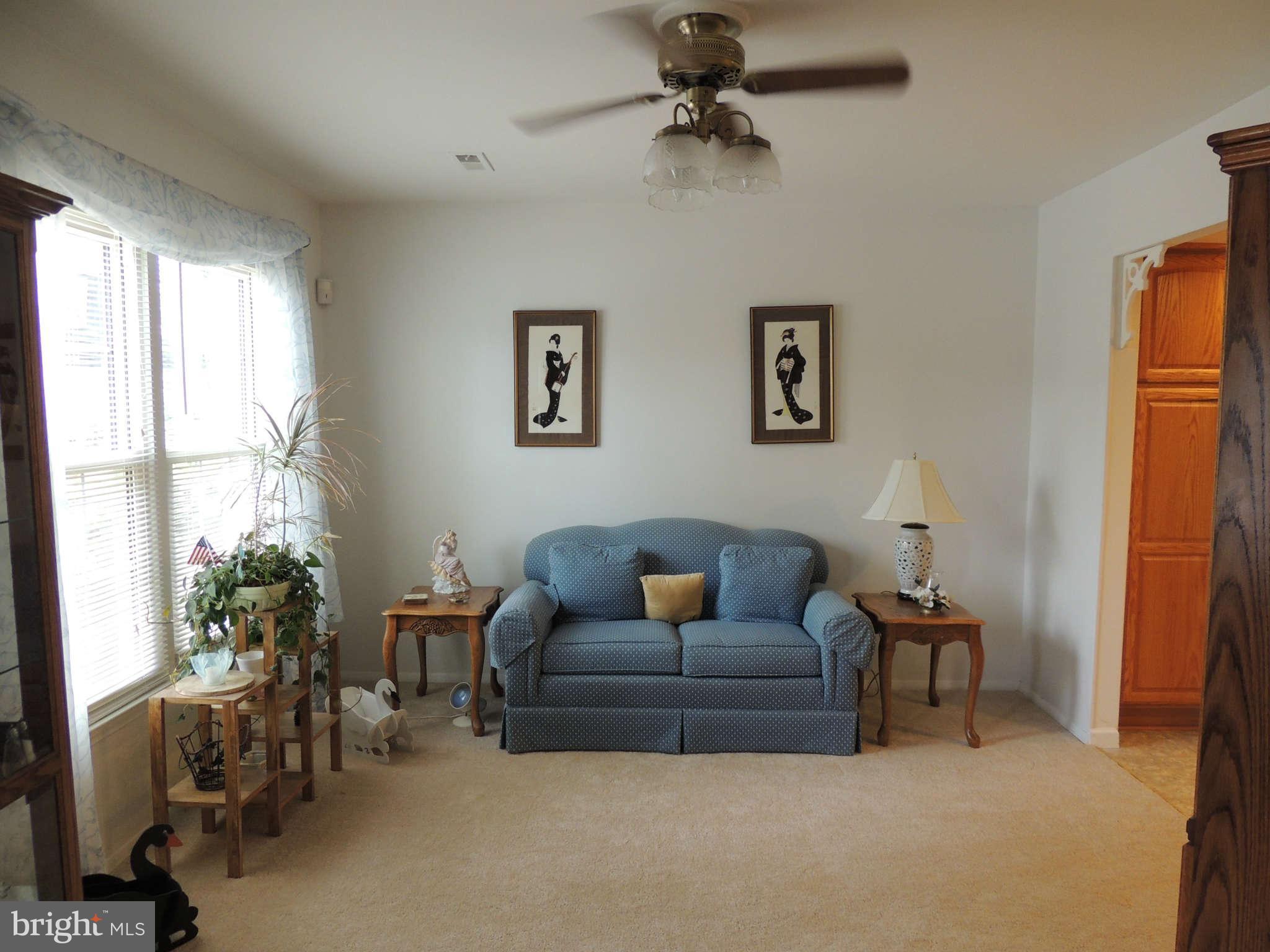3795 Port Hope Point Triangle, VA 22172 - Photo 6 of 26 a living room with furniture and a window