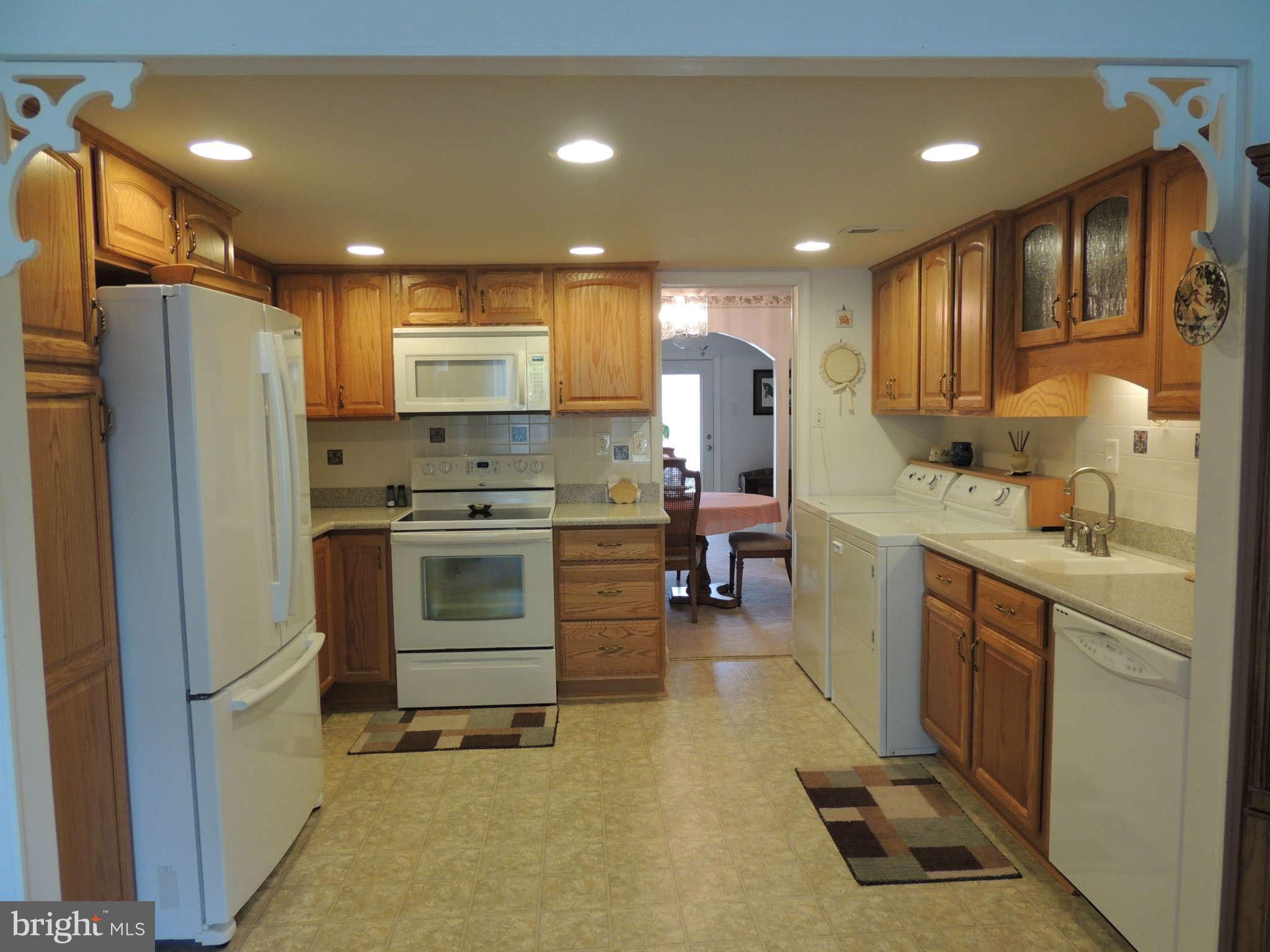 3795 Port Hope Point Triangle, VA 22172 - Photo 10 of 26 a kitchen with a sink stainless steel appliances and cabinets