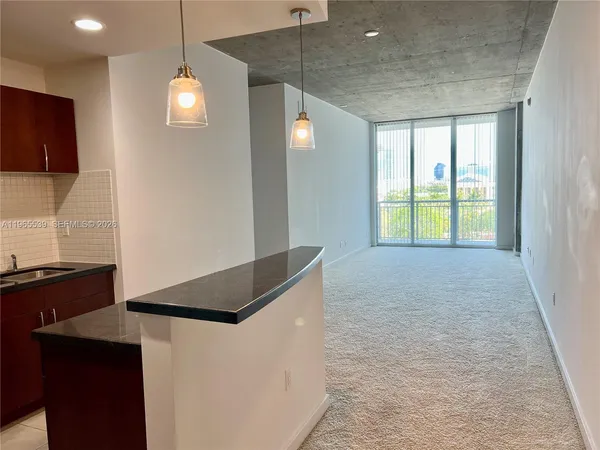 a kitchen that has a sink and a stove