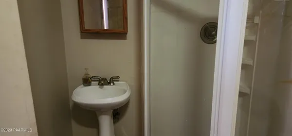 a bathroom with a toilet and a sink