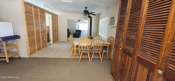 a dining room with furniture and a chandelier