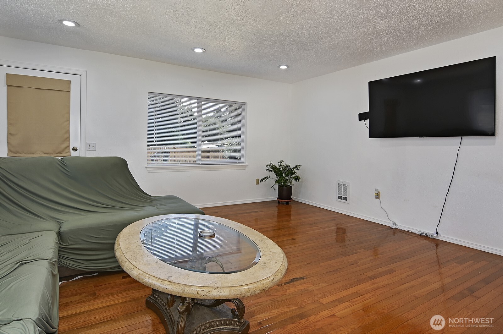 7660 South 126th Street Seattle, WA 98178 - Photo 14 of 33 a living room with furniture and a flat screen tv