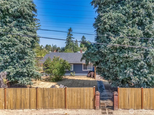 a view of a house with a tree