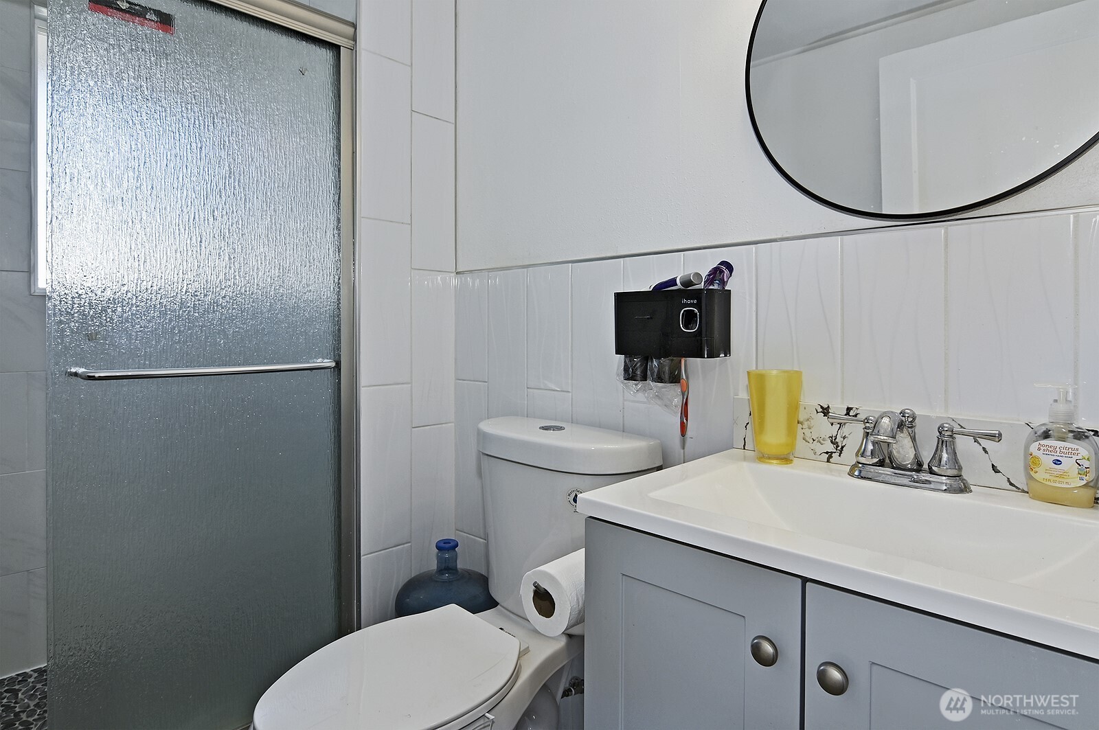 7660 South 126th Street Seattle, WA 98178 - Photo 22 of 33 a bathroom with a sink toilet and a mirror