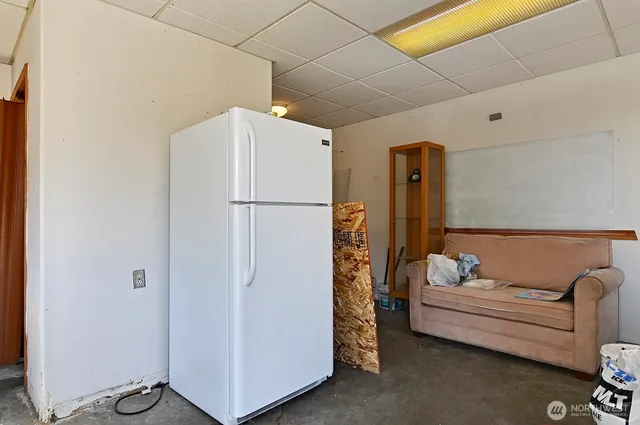 a bathroom with a sink toilet and a mirror
