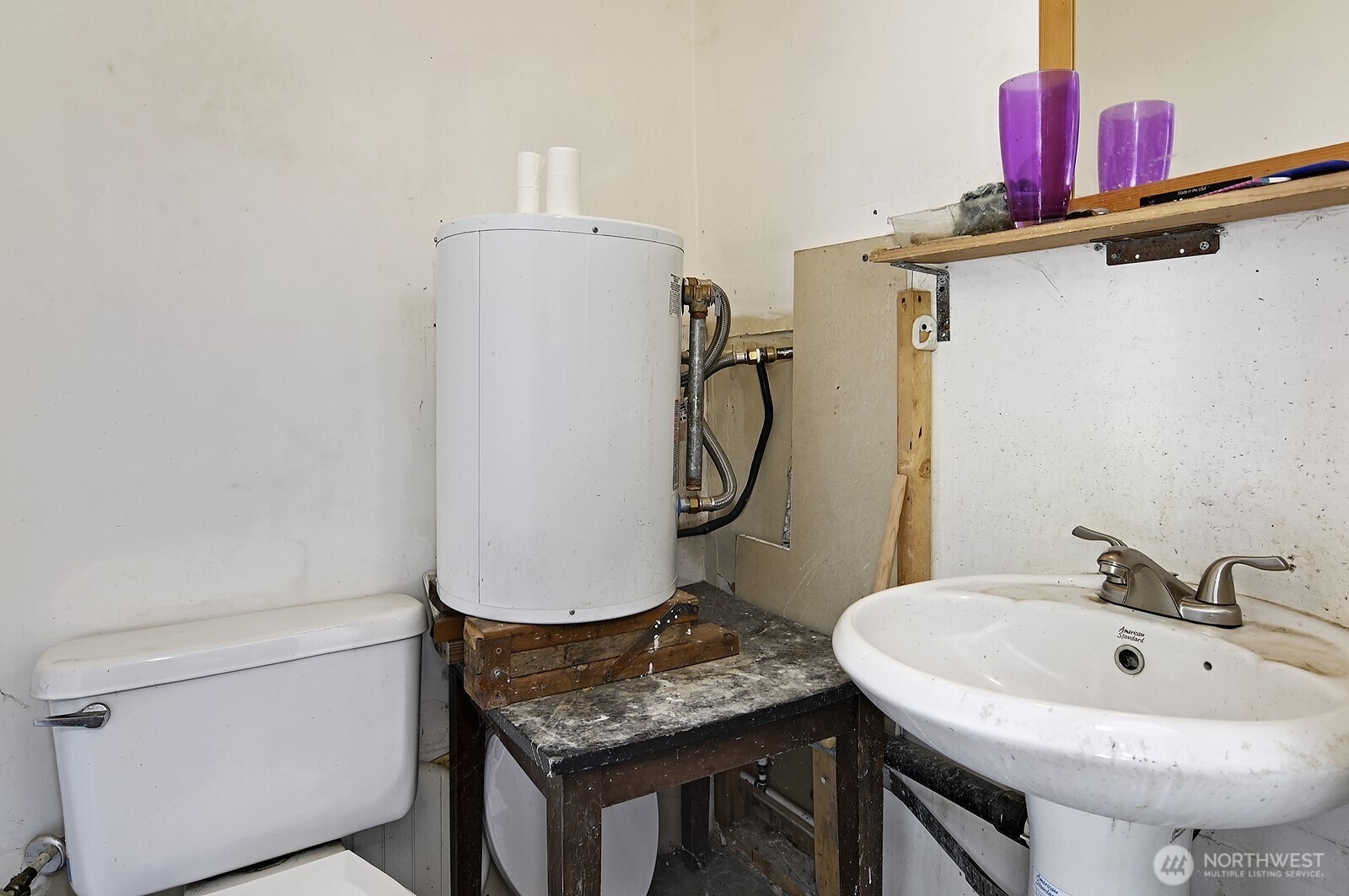 7660 South 126th Street Seattle, WA 98178 - Photo 31 of 33 a bathroom with a sink toilet and a mirror