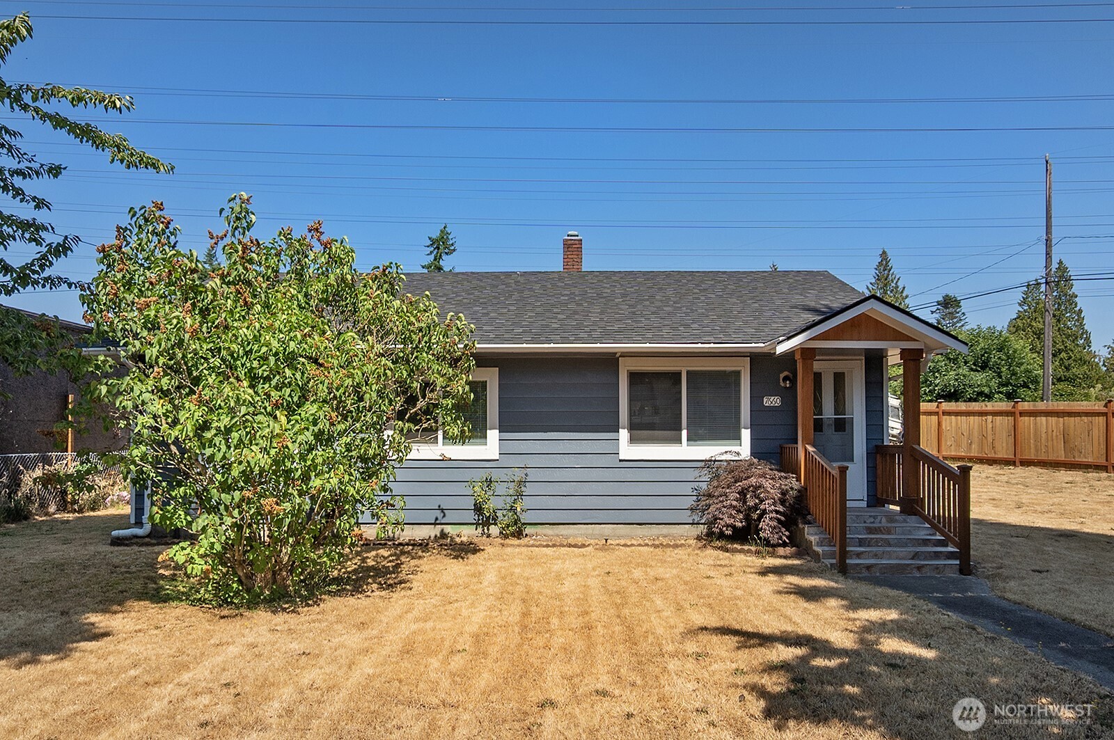 7660 South 126th Street Seattle, WA 98178 - Photo 4 of 33 a view of a house with a yard