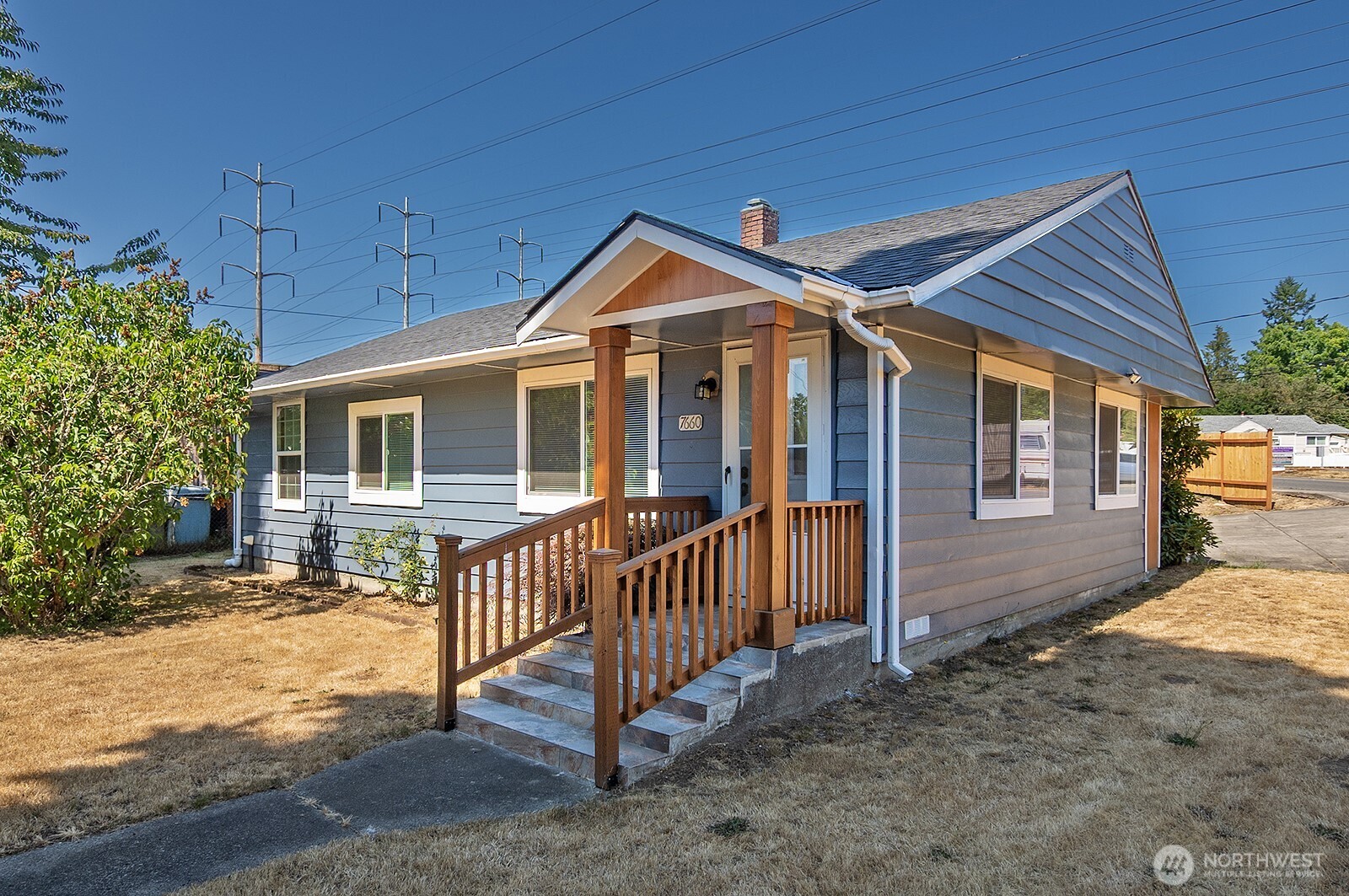 7660 South 126th Street Seattle, WA 98178 - Photo 5 of 33 a front view of a house with a yard