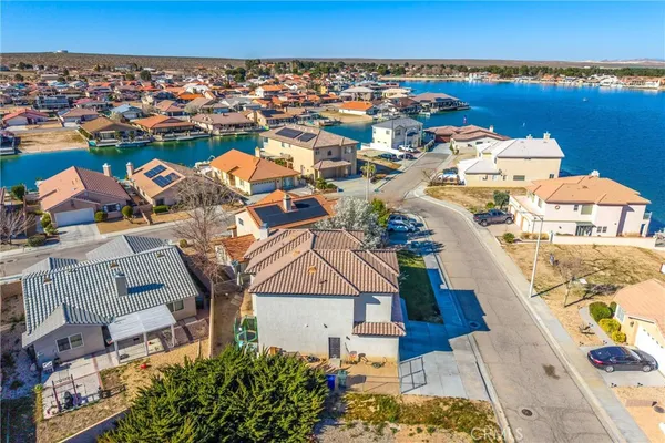 an aerial view of a city with lots of residential buildings in ocean