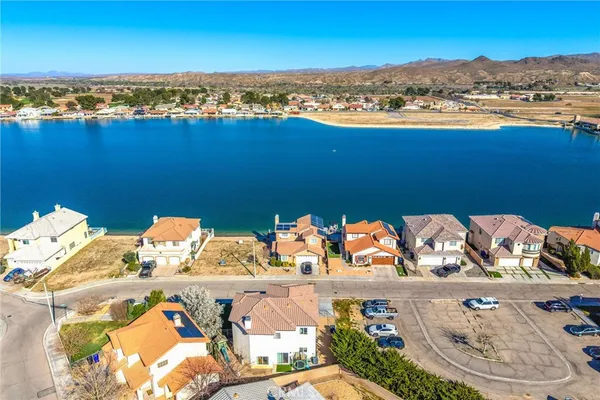 an aerial view of a house with a lake view