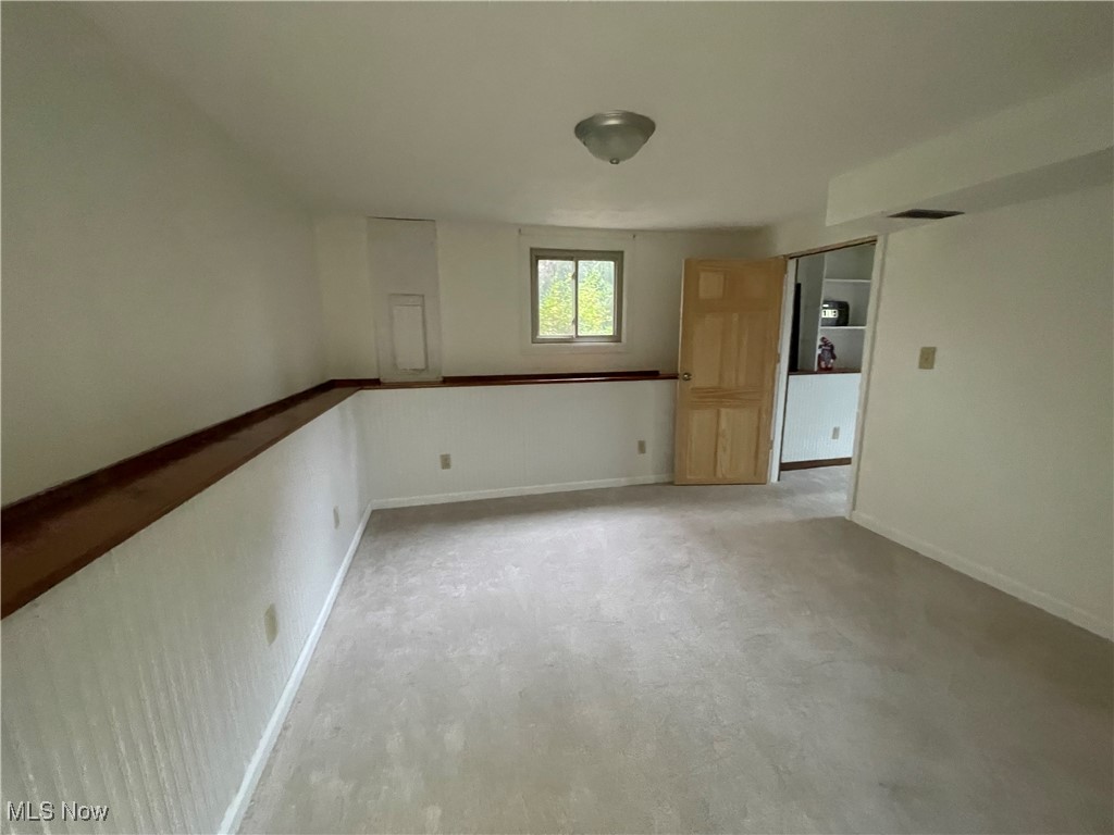 1984 Hebron Road St. Marys, WV 26170 - Photo 26 of 33 Empty room featuring baseboards and concrete floors