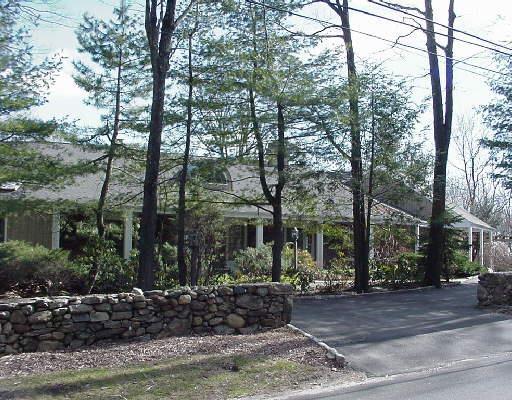a view of a house with a yard and street view