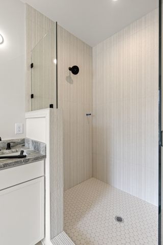 a bathroom with a double vanity sink and a mirror