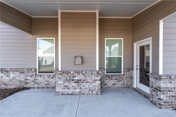 a front view of a house with a porch