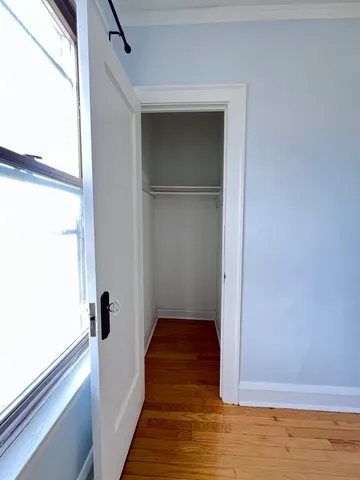 a kitchen with a stove top oven and cabinets