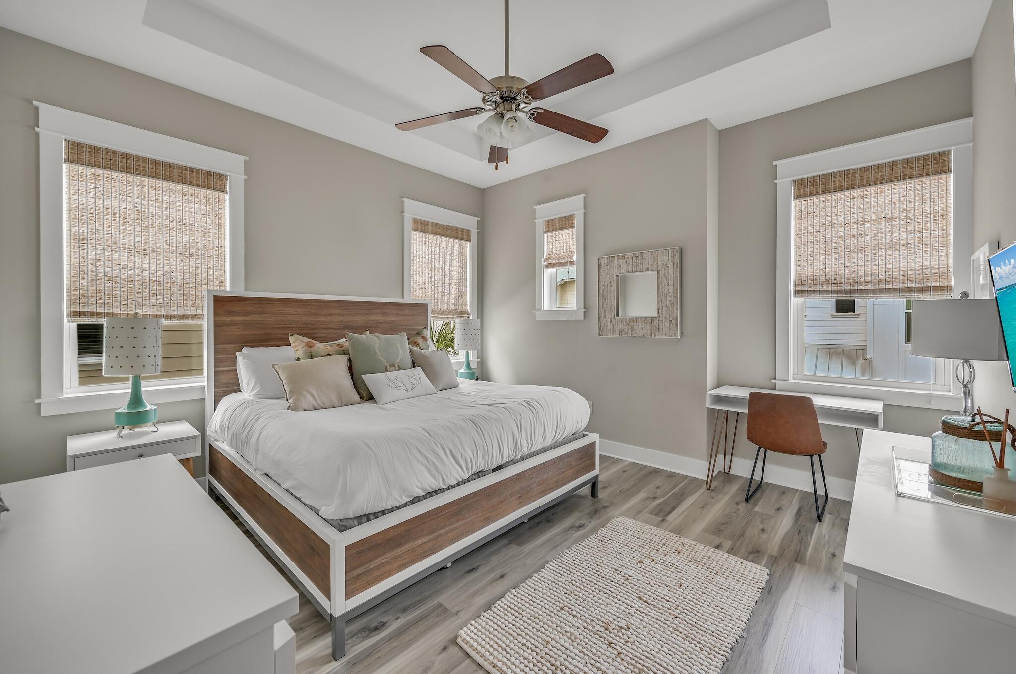 35 East Milestone Dr Inlet Beach, Unit A Inlet Beach, FL 32461 - Photo 19 of 45 a bedroom with a bed a window and chair