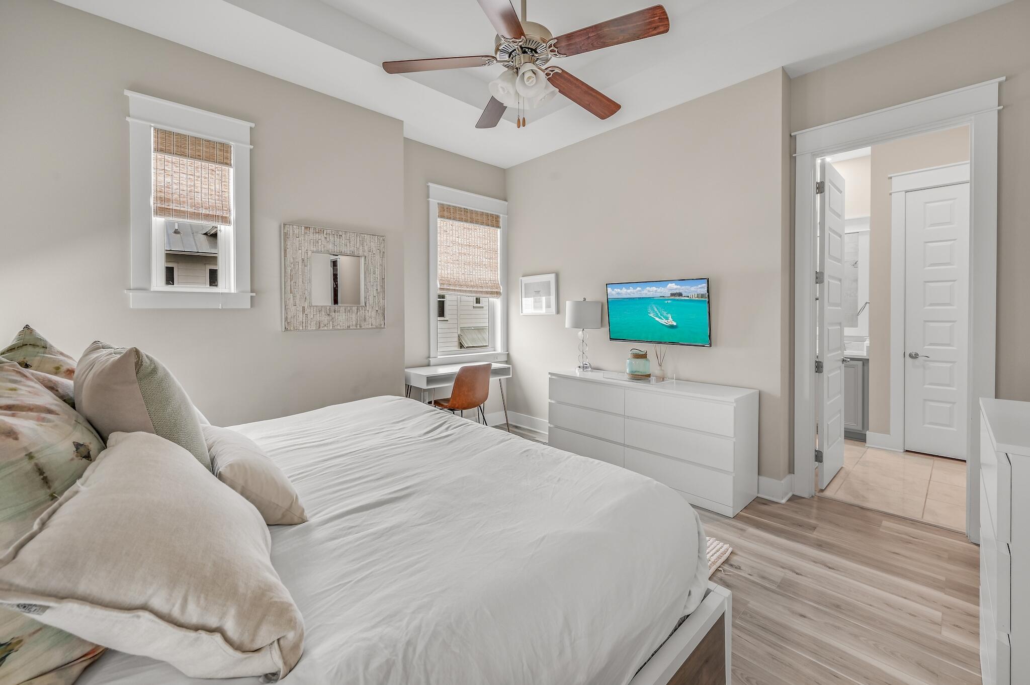 35 East Milestone Dr Inlet Beach, Unit A Inlet Beach, FL 32461 - Photo 20 of 45 a bedroom with a bed and a flat screen tv