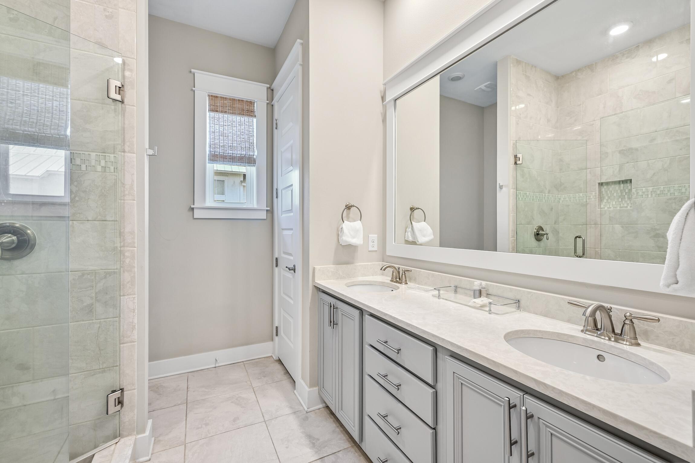 35 East Milestone Dr Inlet Beach, Unit A Inlet Beach, FL 32461 - Photo 21 of 45 a bathroom with a sink double vanity and a mirror