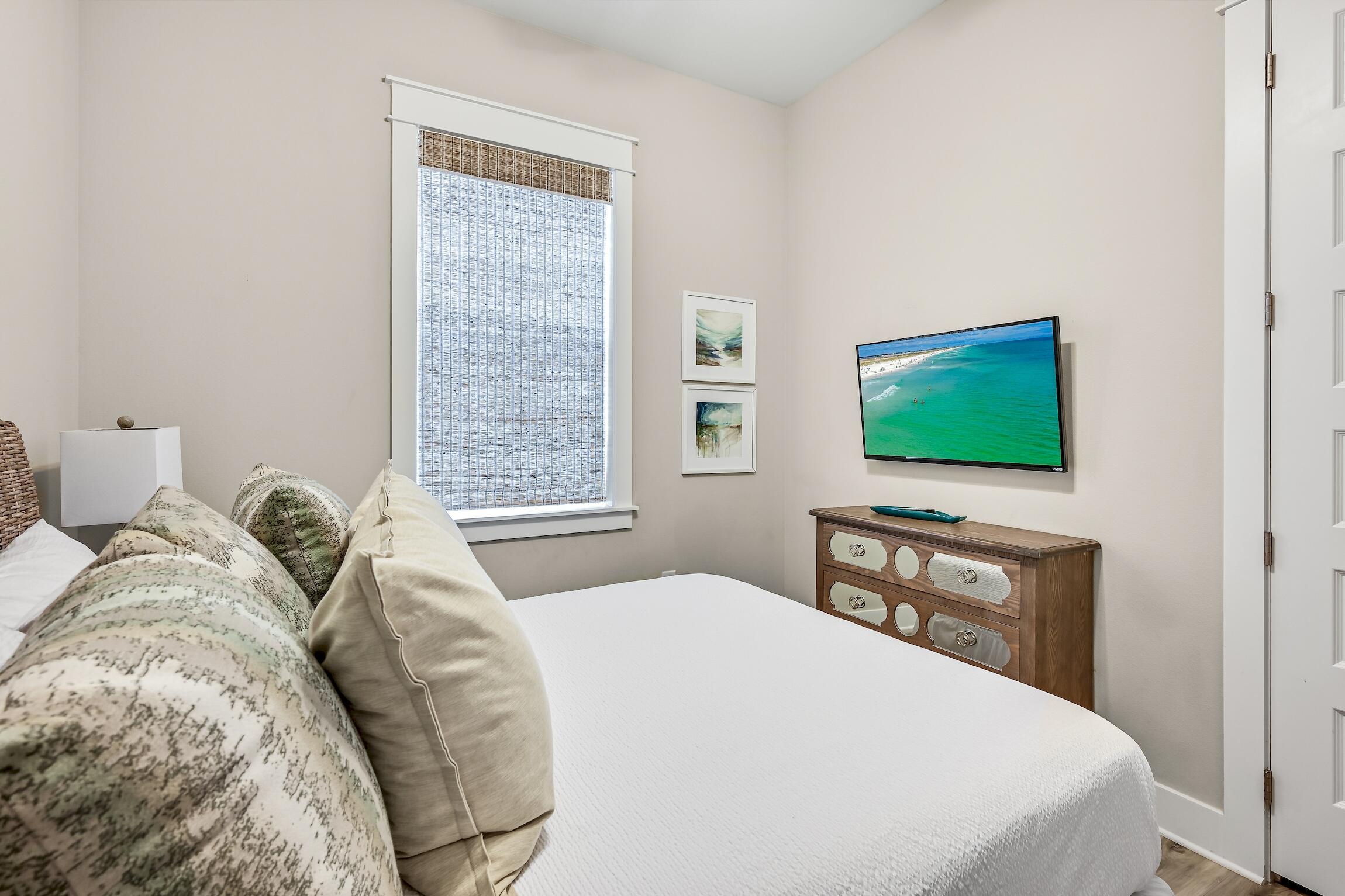 35 East Milestone Dr Inlet Beach, Unit A Inlet Beach, FL 32461 - Photo 23 of 45 a bedroom with a bed and a flat screen tv