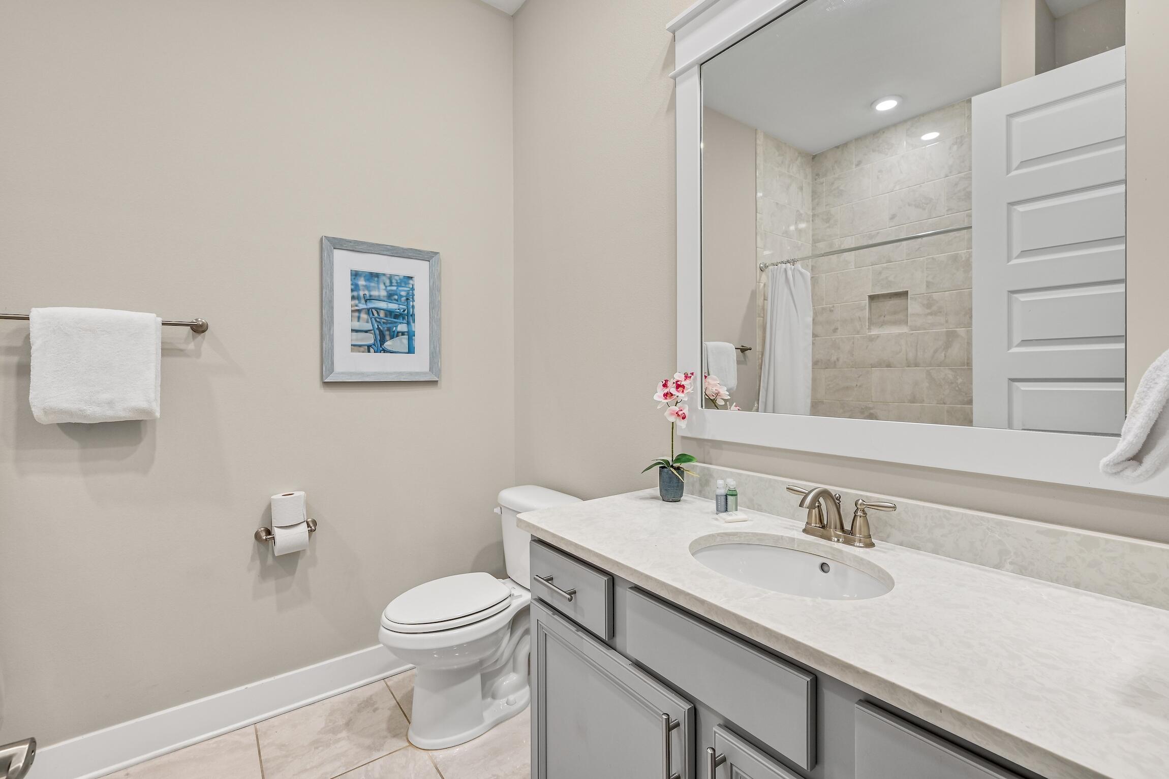 35 East Milestone Dr Inlet Beach, Unit A Inlet Beach, FL 32461 - Photo 24 of 45 a bathroom with a toilet sink and mirror