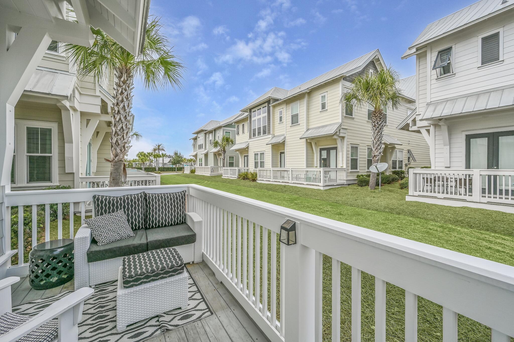 35 East Milestone Dr Inlet Beach, Unit A Inlet Beach, FL 32461 - Photo 28 of 45 a view of a house with a yard and furniture