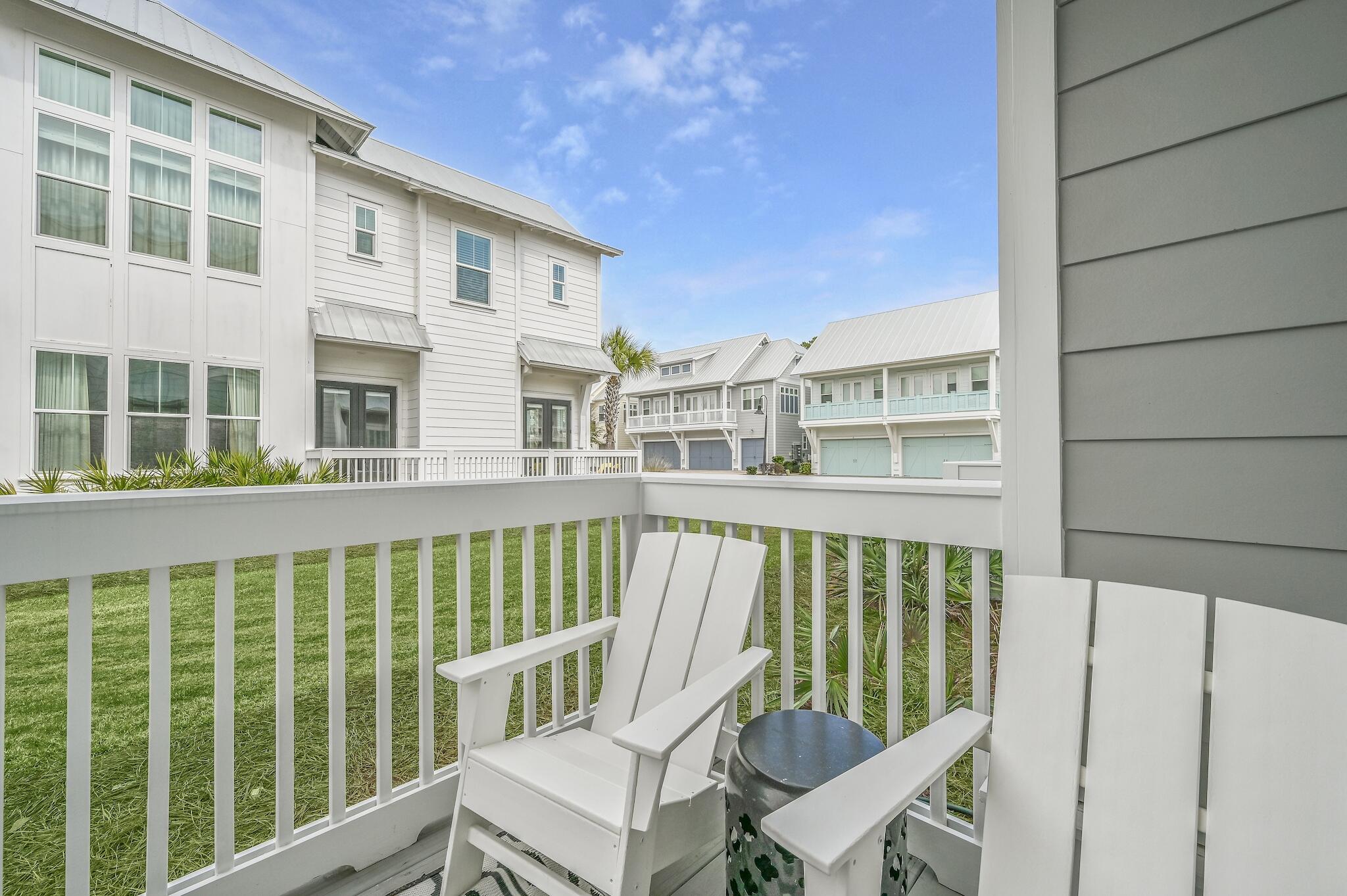 35 East Milestone Dr Inlet Beach, Unit A Inlet Beach, FL 32461 - Photo 29 of 45 a view of a chair and table in the balcony