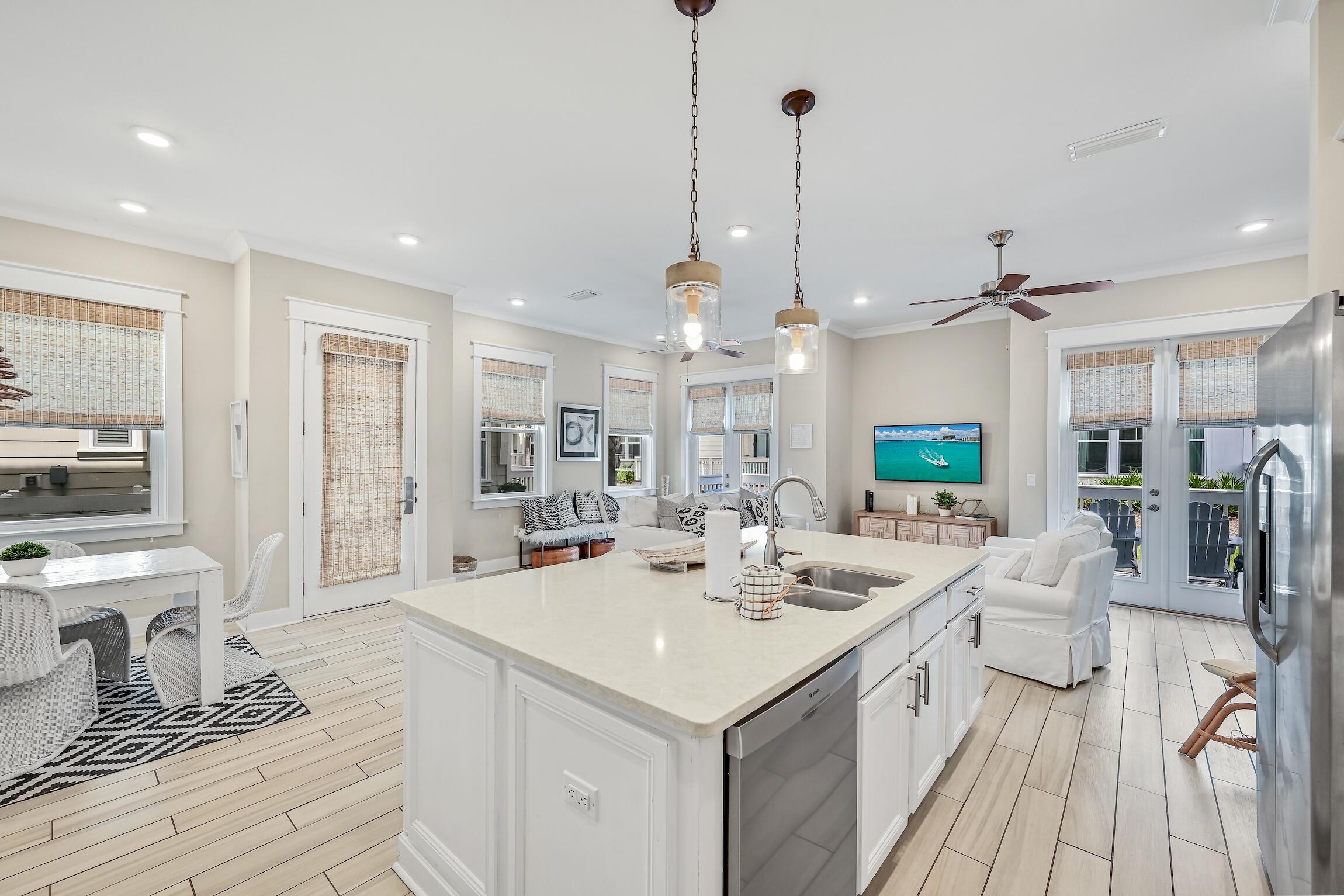 35 East Milestone Dr Inlet Beach, Unit A Inlet Beach, FL 32461 - Photo 10 of 45 a very nice looking room with a large window and chandelier