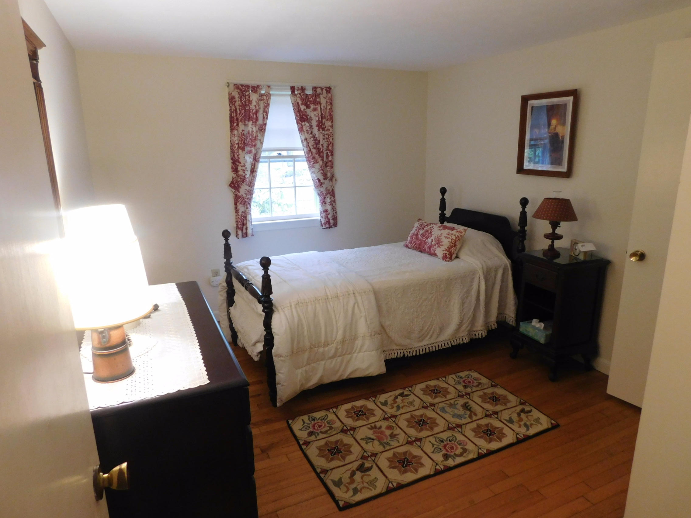 202 Woodside Road West Barnstable, MA 02668 - Photo 17 of 21 a bedroom with a bed and wooden floor