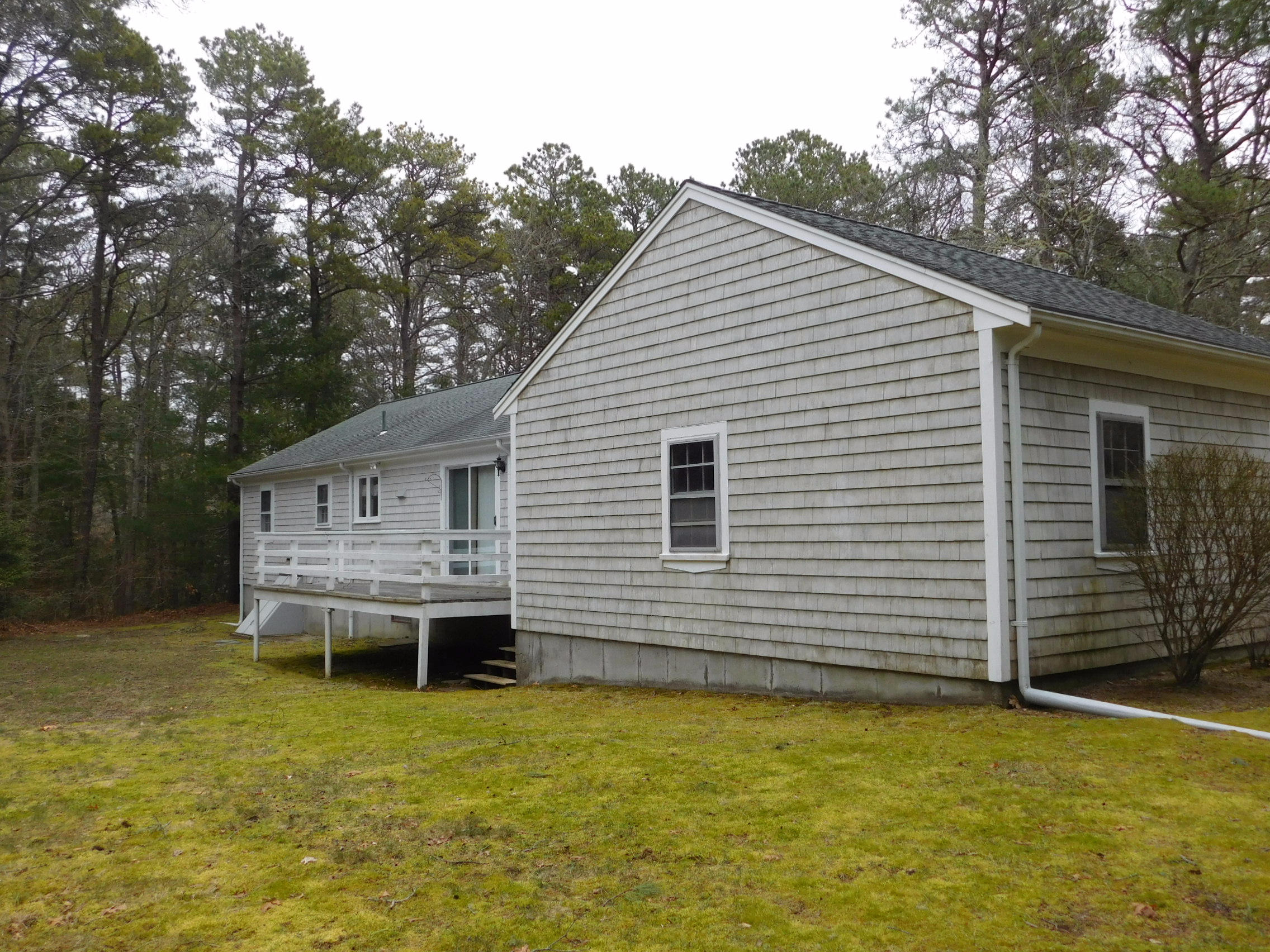 202 Woodside Road West Barnstable, MA 02668 - Photo 4 of 21 a backyard of a house with table and chairs