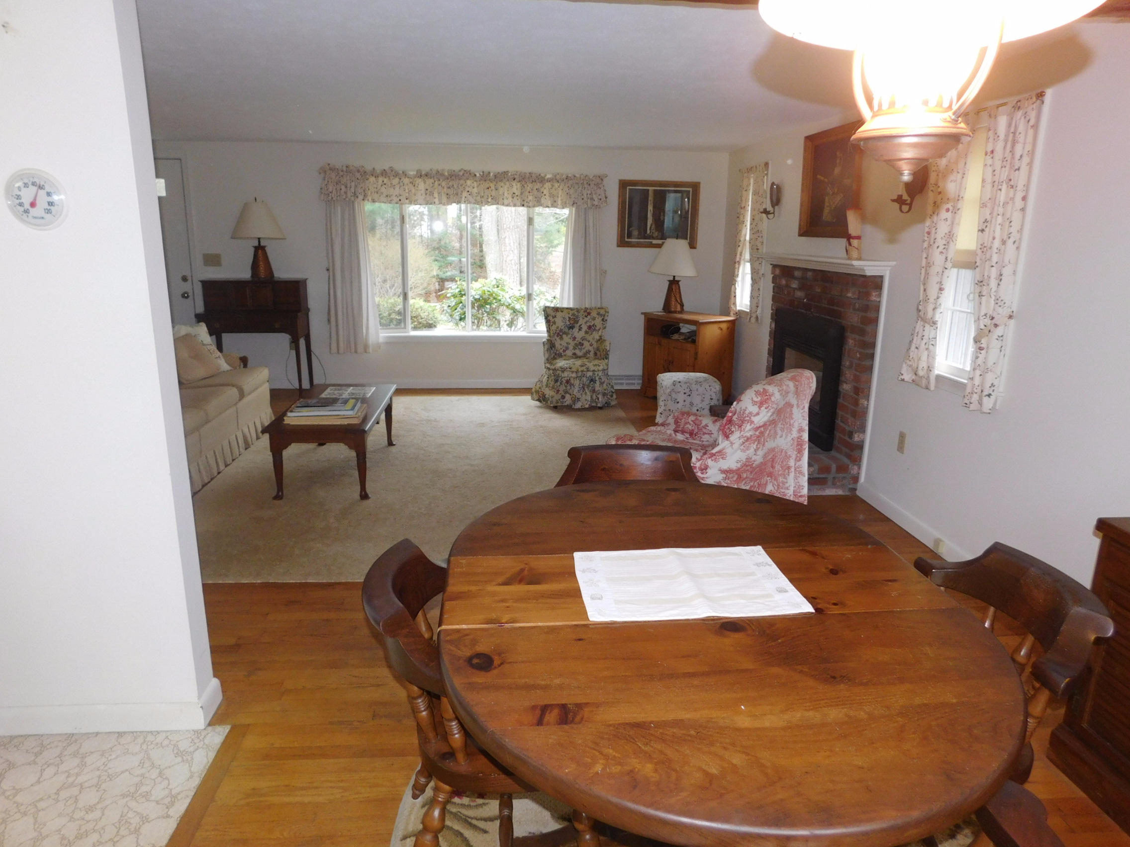 202 Woodside Road West Barnstable, MA 02668 - Photo 8 of 21 a living room with furniture and a fireplace