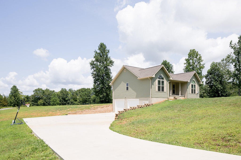 149 Fairview Road Athens, TN 37303 - Photo 15 of 17 a front view of a house with a yard and trees