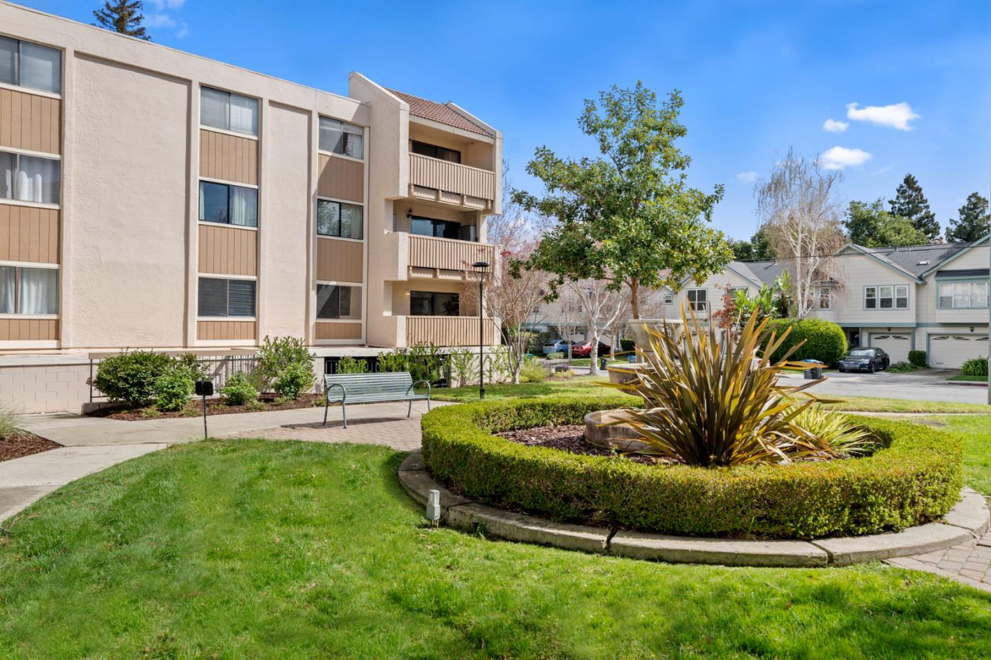 a view of a house with a yard and plants