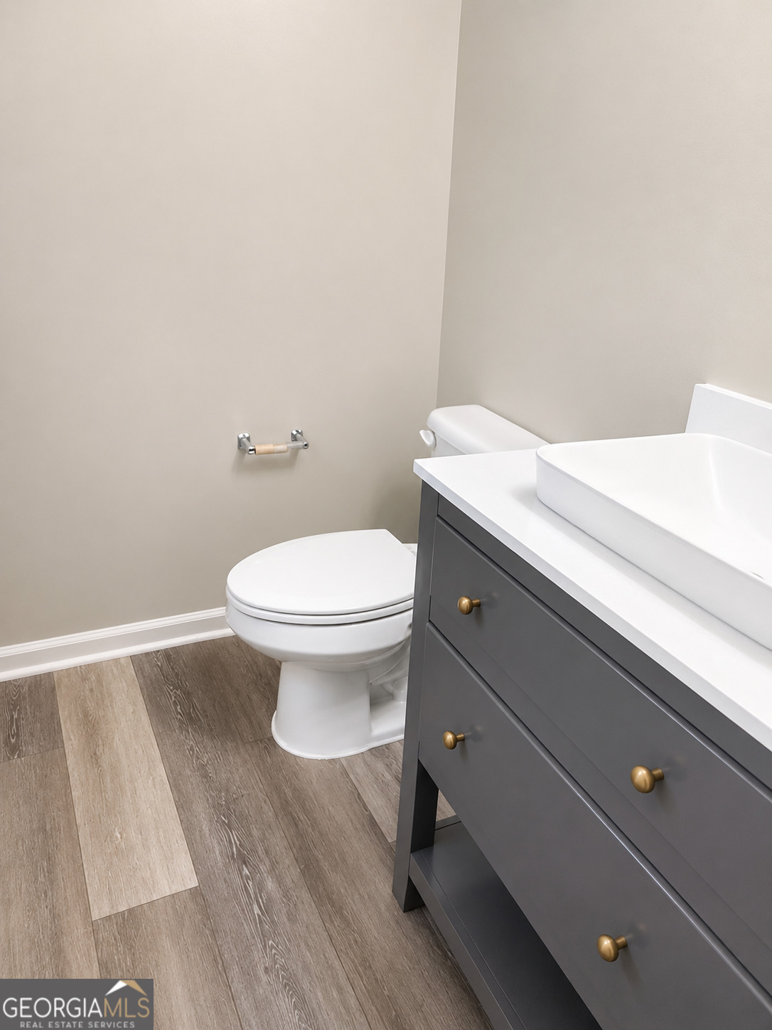 105 Dailey Mill Road McDonough, GA 30253 - Photo 11 of 19 a bathroom with a toilet and a sink