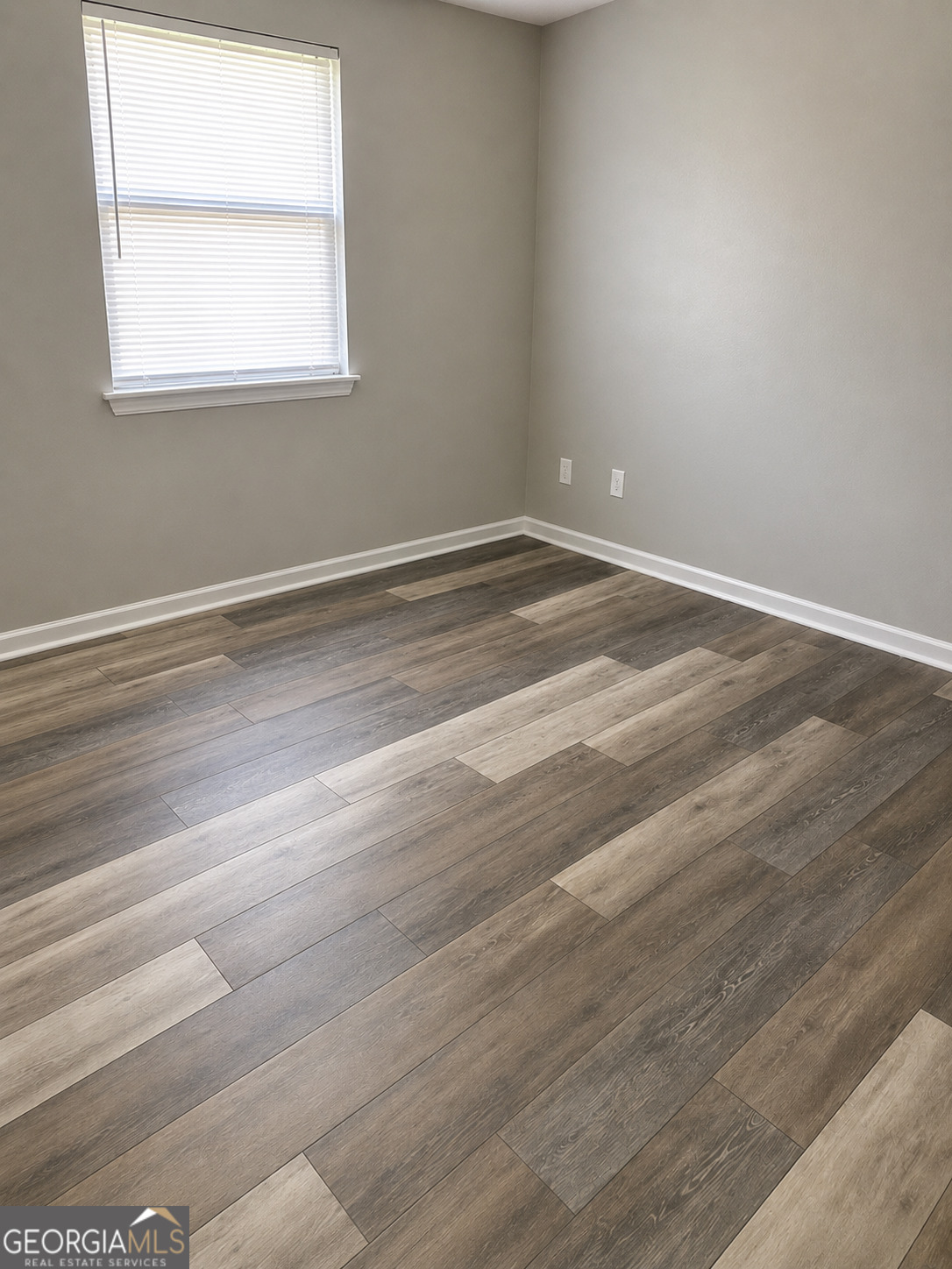 105 Dailey Mill Road McDonough, GA 30253 - Photo 14 of 19 a view of a room with wooden floor and windows in it