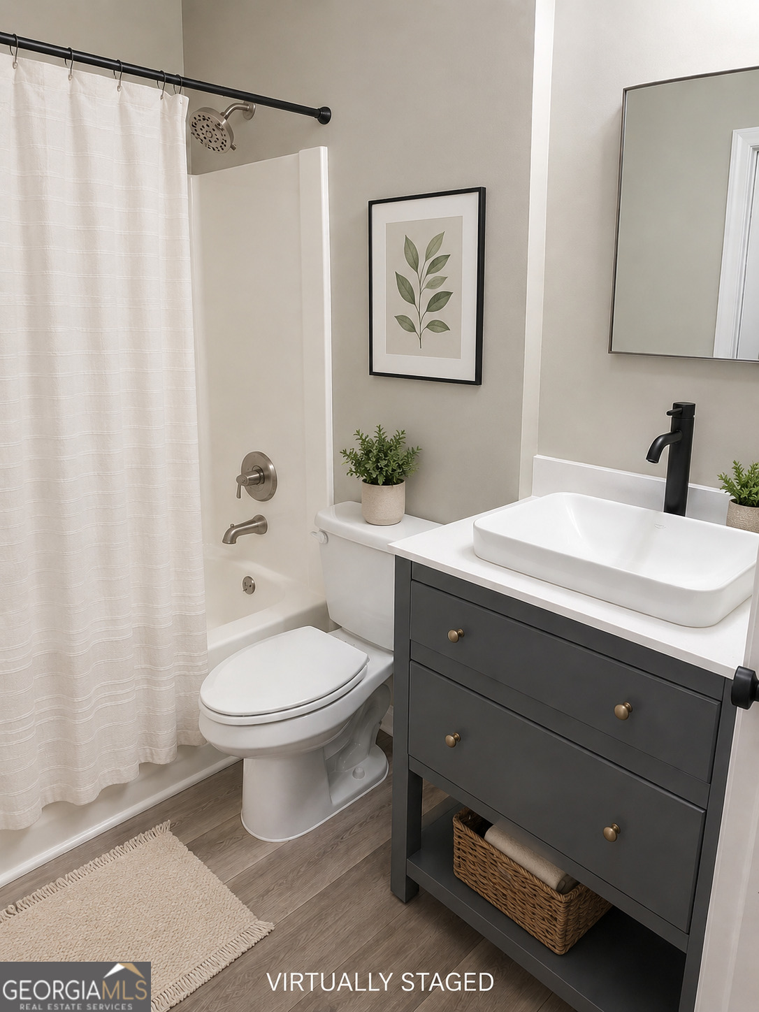 105 Dailey Mill Road McDonough, GA 30253 - Photo 18 of 19 a bathroom with a toilet a sink and a mirror