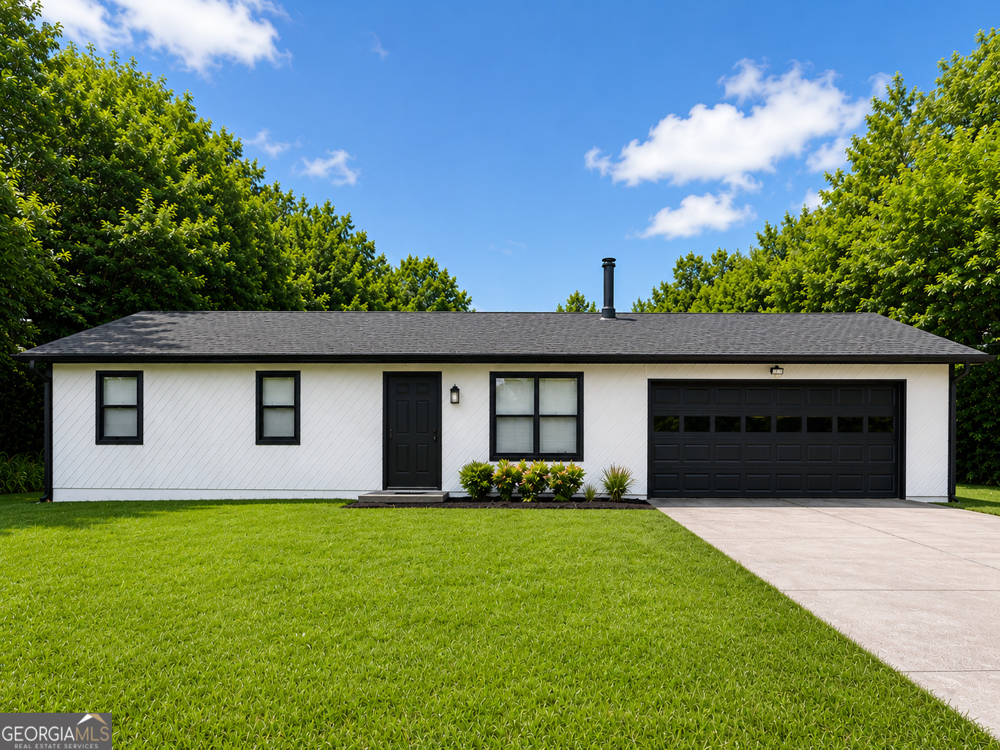 105 Dailey Mill Road McDonough, GA 30253 - Photo 2 of 19 a front view of house with yard and trees